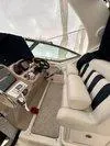 Slide: The Image of Interior of a 2005 Sea Ray 320 Sundancer boat with helm and seating area. - 10