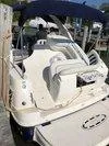 Slide: The Image of 2005 Sea Ray 320 Sundancer boat with seating and canopy, docked at marina. - 16