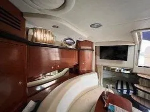 Slide: The Image of Interior of 2005 Sea Ray 320 Sundancer yacht with elegant wood finish and modern amenities. - 23