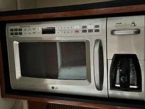 Slide: The Image of Built-in LG microwave and coffee maker on a 2005 Sea Ray 320 Sundancer yacht. - 26