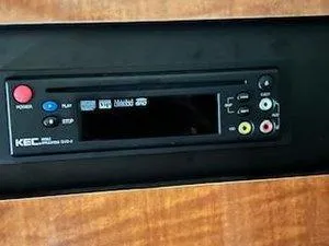 Slide: The Image of KEC DVD player in 2005 Sea Ray 320 Sundancer boat interior. - 27
