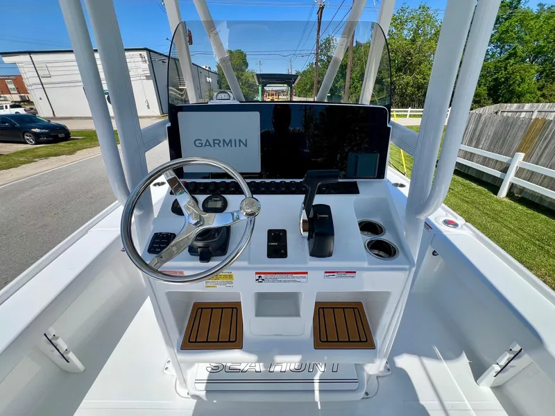 Slide: The Image of 2025 Sea Hunt BX22BR boat console with Garmin navigation system and steering wheel. - 11