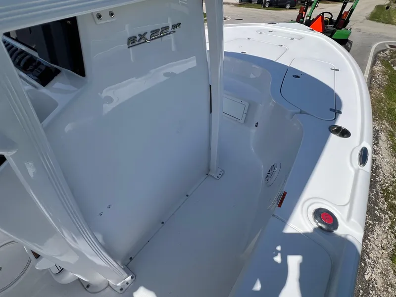 Slide: The Image of 2025 Sea Hunt BX22BR boat interior, showcasing sleek white design and spacious layout. - 16