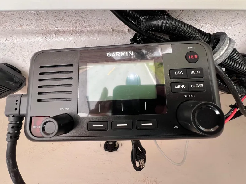 Slide: The Image of Garmin marine radio installed on a 2025 Sea Hunt BX22BR boat dashboard. - 19