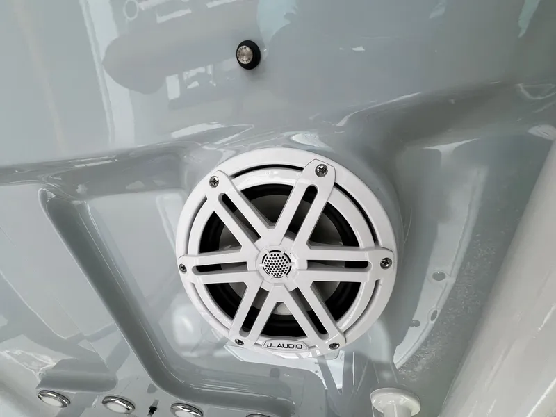 Slide: The Image of White JL Audio speaker on 2025 Sea Hunt BX22BR boat interior. - 20