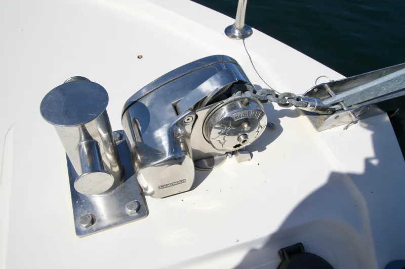 Slide: The Image of Anchor winch on 1995 Camano Troll boat deck, featuring polished metal components. - 10