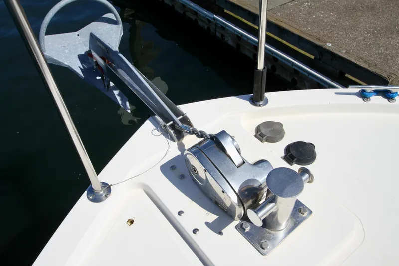 Slide: The Image of 1995 Camano Troll boat anchor system with winch and cleat on deck. - 11