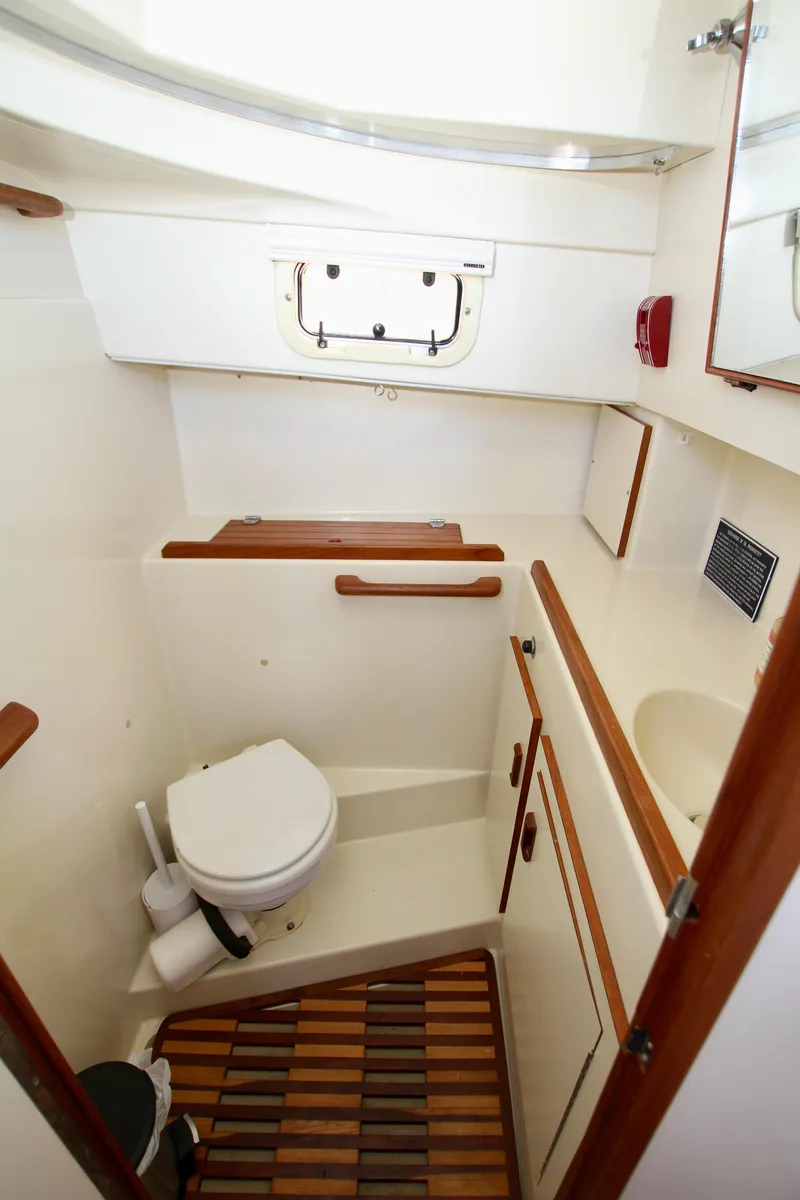 Slide: The Image of 1995 Camano Troll boat bathroom with wooden accents and compact design. - 39