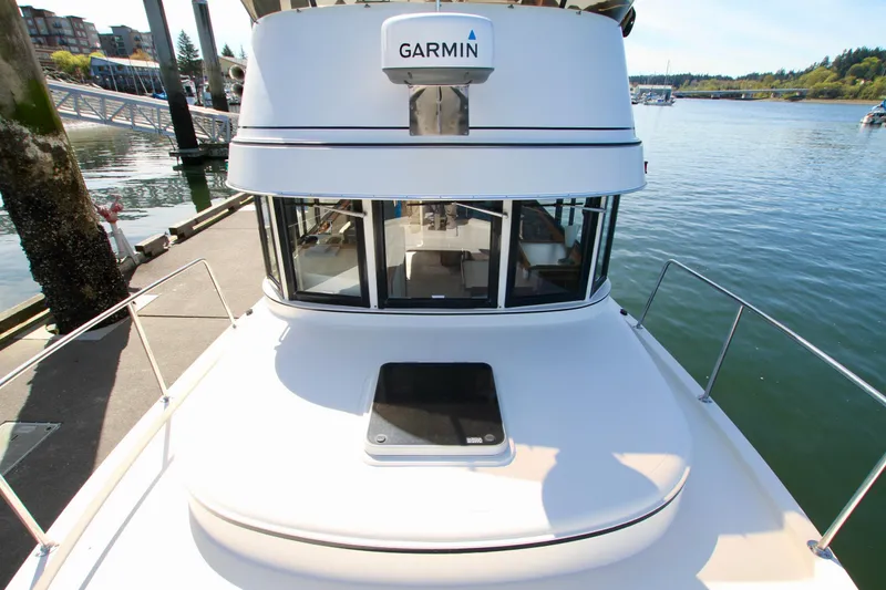 Slide: The Image of 1995 Camano Troll boat with Garmin equipment docked by the water. - 9