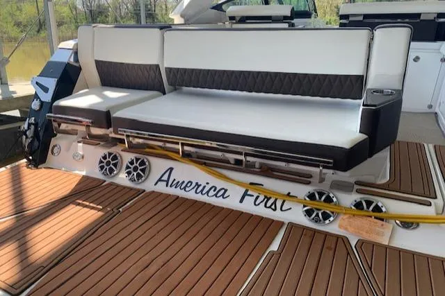 Slide: The Image of 2017 Monterey 378 SE boat with cushioned seating and teak flooring. - 10