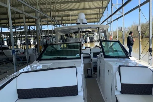 Slide: The Image of 2017 Monterey 378 SE boat docked in a covered marina. - 13
