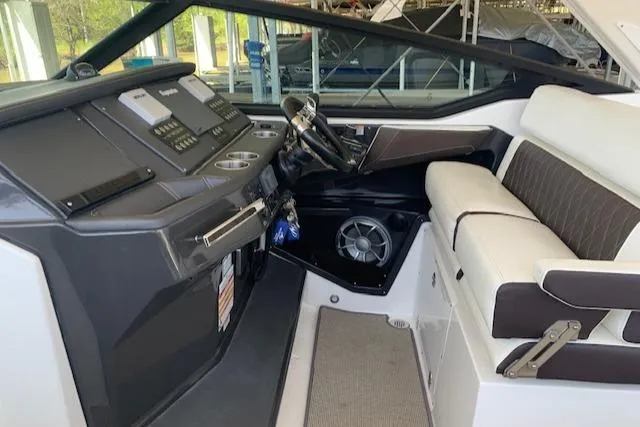 Slide: The Image of 2017 Monterey 378 SE boat interior with modern dashboard and comfortable seating. - 16