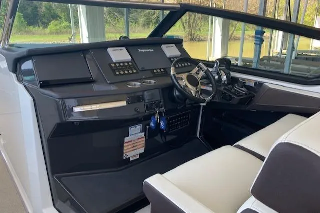 Slide: The Image of 2017 Monterey 378 SE boat cockpit with modern controls and steering wheel. - 17
