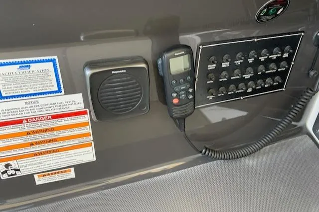 Slide: The Image of Control panel of a 2017 Monterey 378 SE boat with speaker and radio handset. - 23