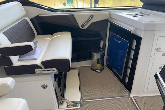 Slide: The Image of Interior of a 2017 Monterey 378 SE boat with seating and kitchenette area. - 24