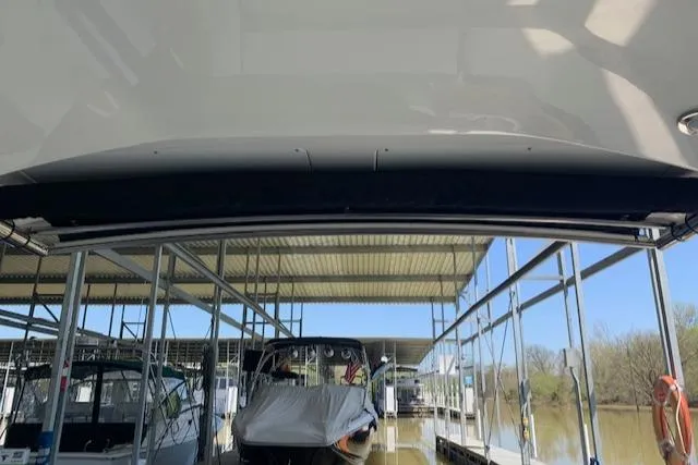 Slide: The Image of 2017 Monterey 378 SE boat docked in a covered marina. - 25