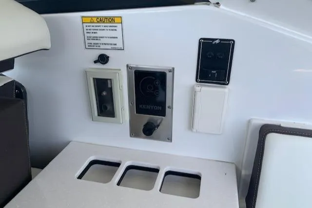 Slide: The Image of Control panel on 2017 Monterey 378 SE boat with various switches and outlets. - 26
