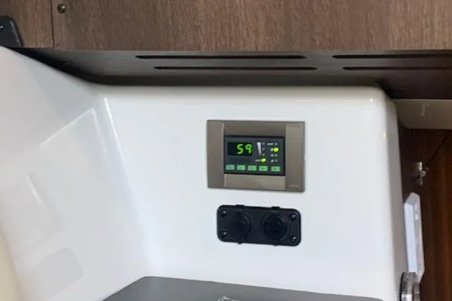 Slide: The Image of Control panel inside 2017 Monterey 378 SE boat, displaying digital interface and outlets. - 28