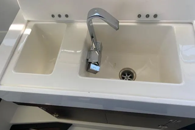 Slide: The Image of Modern sink with dual basins and sleek faucet in a 2017 Monterey 378 SE boat. - 33