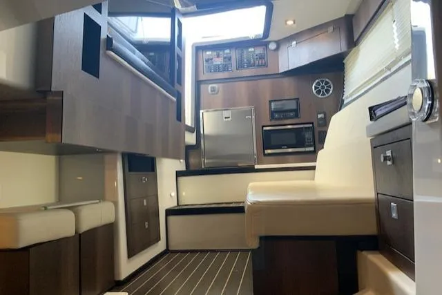 Slide: The Image of Interior of 2017 Monterey 378 SE boat with modern kitchen and seating area. - 39