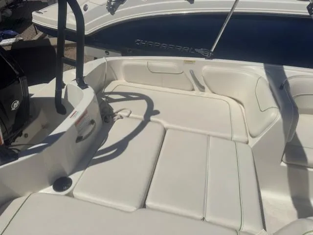 Slide: The Image of Bayliner Element E18 boat interior, 2003 model, featuring white seating and steering area. - 5