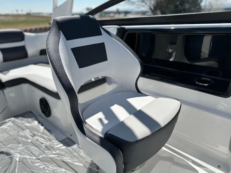 Slide: The Image of 2025 Yamaha Boats 195S interior with sleek, modern seating and dashboard design. - 12