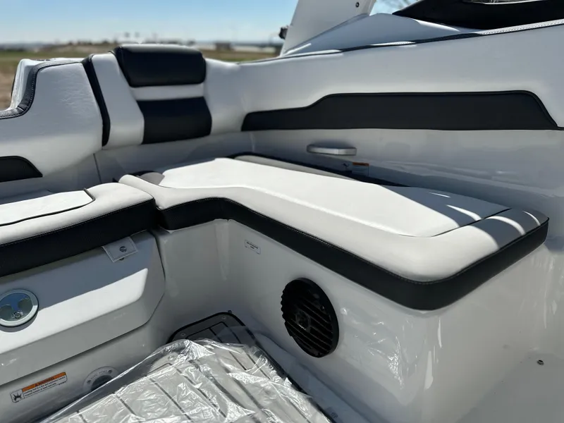 Slide: The Image of 2025 Yamaha Boats 195S interior seating with sleek black and white design. - 13