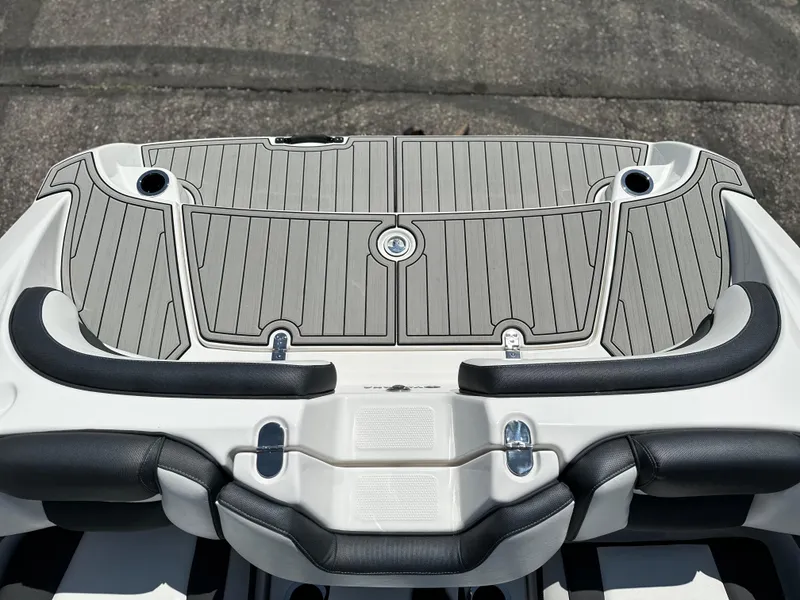 Slide: The Image of 2025 Yamaha Boats 195S swim platform with sleek design and integrated cup holders. - 17