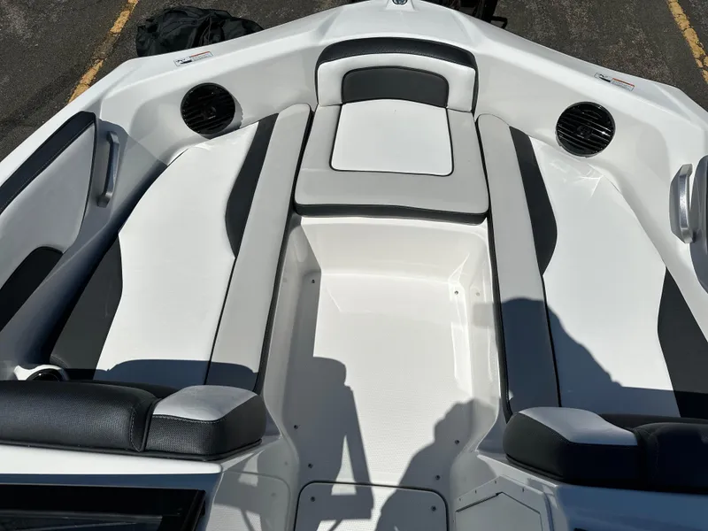 Slide: The Image of 2025 Yamaha Boats 195S interior with sleek white and black seating design. - 7