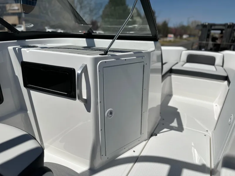Slide: The Image of 2025 Yamaha Boats 195S interior, featuring sleek white design and modern seating. - 9