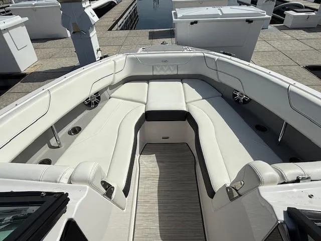 Slide: The Image of 2020 Regal LS6 Surf boat interior with modern dashboard and open cabin view. - 14