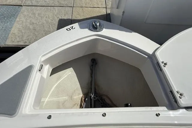 Slide: The Image of 2020 Regal LS6 Surf boat interior with white seating and cup holders. - 15