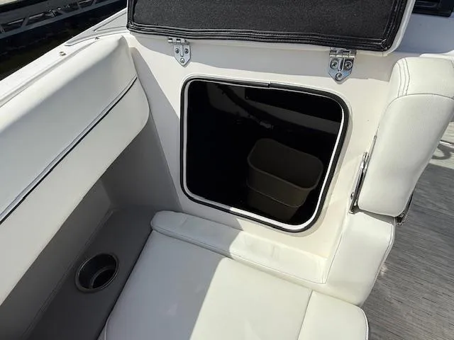 Slide: The Image of 2020 Regal LS6 Surf boat interior seating with storage compartment. - 17