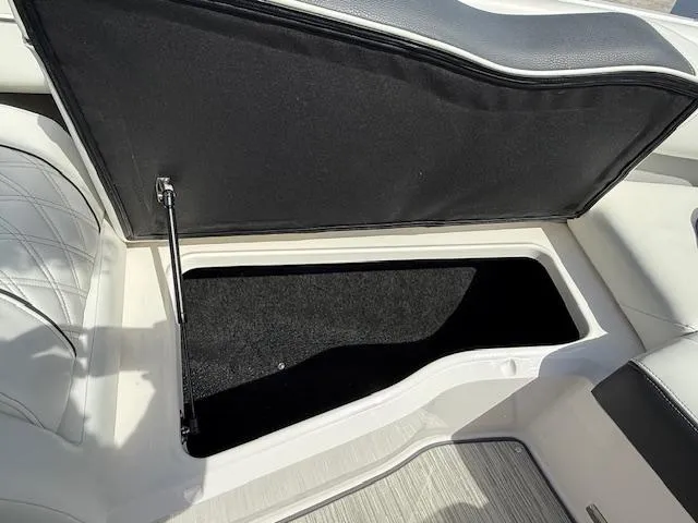 Slide: The Image of Open storage compartment in 2020 Regal LS6 Surf boat interior. - 19