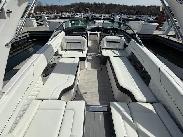 Slide: The Image of 2020 Regal LS6 Surf boat interior with luxurious white seating and modern design. - 21