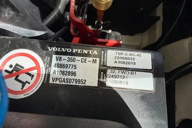 Slide: The Image of 2020 Regal LS6 Surf boat with blue cover docked at marina. - 37