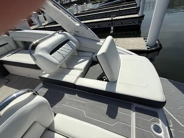 Slide: The Image of 2020 Regal LS6 Surf boat interior with luxurious white seating and sleek design. - 6