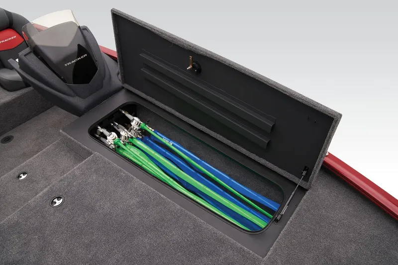 Slide: The Image of 2025 Tracker Savage 215 boat with open storage compartment, showcasing organized fishing rods. - 31