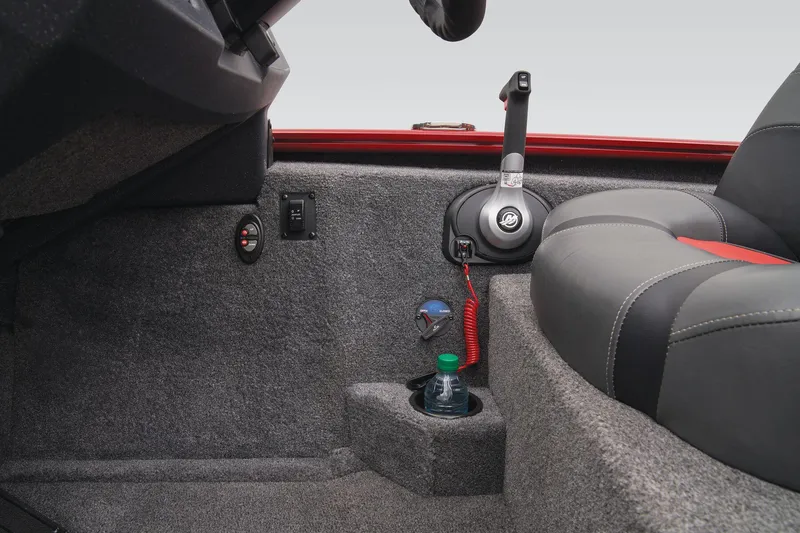 Slide: The Image of Interior of 2025 Tracker Savage 215 boat with cup holder and control panel. - 48