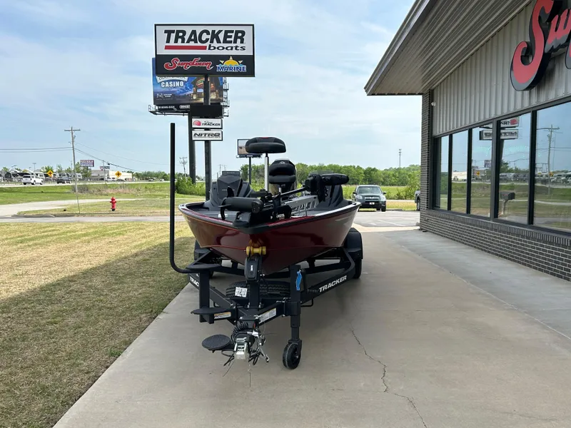 Slide: The Image of 2025 Tracker Savage 215 boat on trailer outside dealership. - 5
