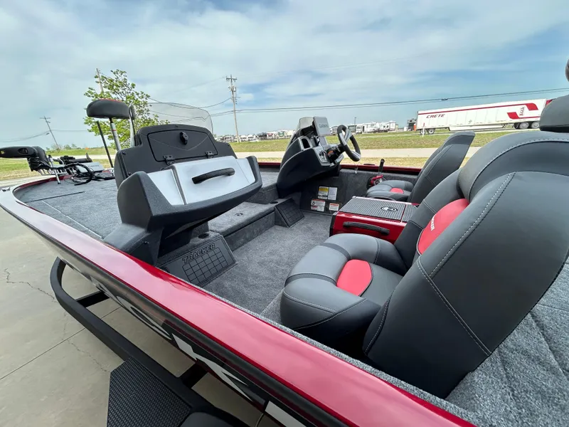 Slide: The Image of 2025 Tracker Savage 215 boat interior with modern seating and dashboard. - 9