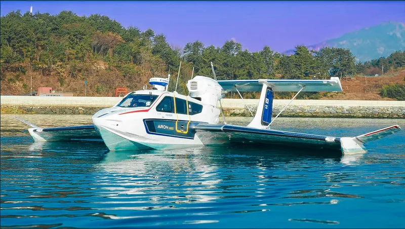 Slide: The Image of Seaplane Aron M 80 flying over scenic coastal landscape, 2026 model. - 2