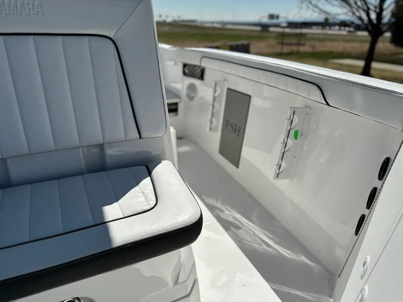 Slide: The Image of 2025 Yamaha Boats 222 FSH Sport interior with sleek seating and modern design. - 12
