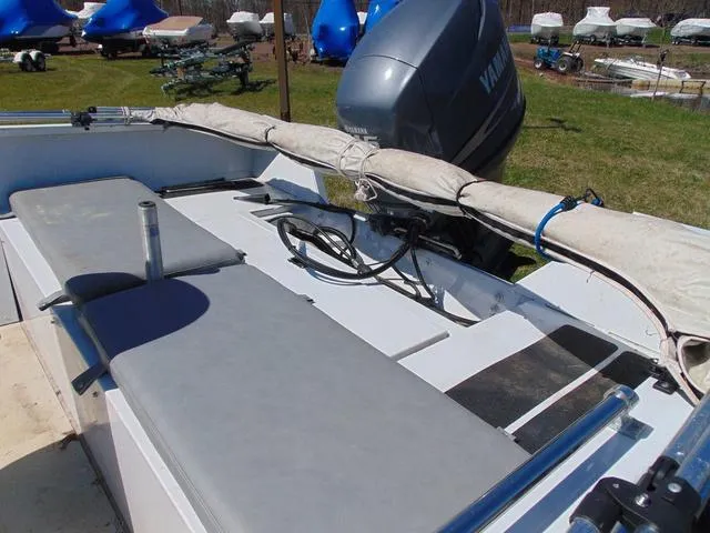 Slide: The Image of 2007 Alumacraft 2072CS boat with Yamaha outboard motor, featuring seating and covered equipment. - 9