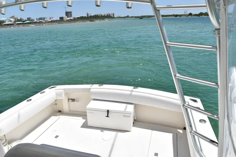 Slide: The Image of 2006 Carolina Classic 32 boat deck with ocean view and city skyline in the background. - 11