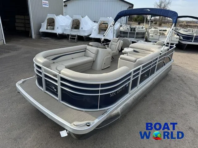 Slide: The Image of 2017 Bennington 21SSX Pontoon boat with blue and beige seating, displayed at Boat World. - 1