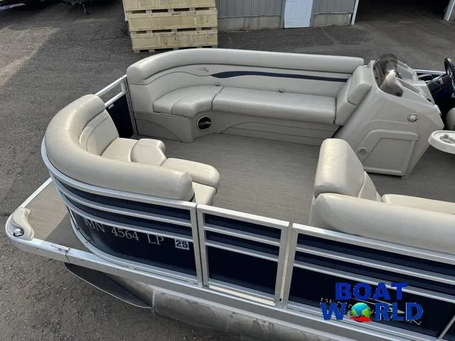 Slide: The Image of 2017 Bennington 21SSX Pontoon with spacious seating and sleek design, docked outdoors. - 11