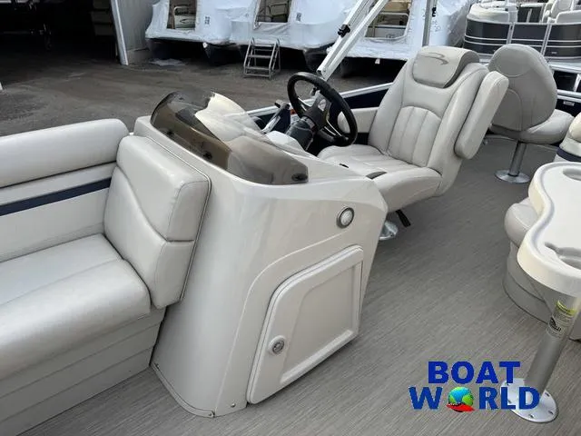 Slide: The Image of 2017 Bennington 21SSX Pontoon interior with steering console and seating, displayed at Boat World. - 13