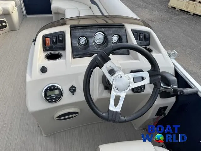 Slide: The Image of 2017 Bennington 21SSX Pontoon boat dashboard with steering wheel and controls. - 15
