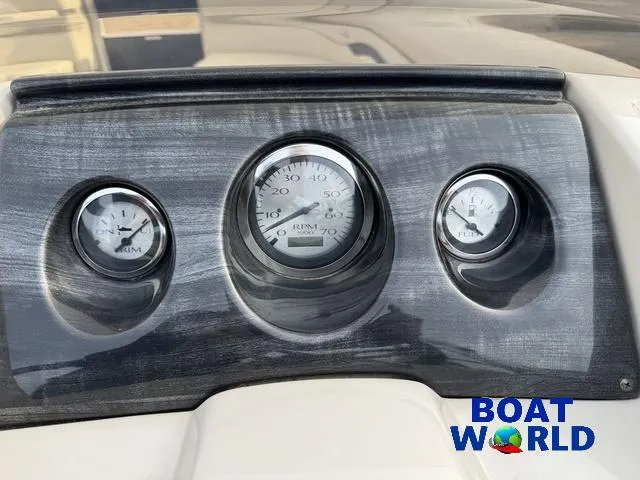 Slide: The Image of Dashboard of 2017 Bennington 21SSX Pontoon with RPM and fuel gauges. - 16